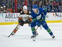 Ducks center Trevor Zegras (left, zeroing in on Canuck Brock Boeser) is always in pursuit of the puck to score highlight-reel goals.