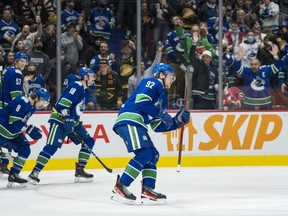 Canucks rookie winger Vasily Podkolzin heads to the bench for some teammates’ high-fives after scoring against Rangers goalie Igor Shesterkin early in the third period of Tuesday’s NHL game at Rogers Arena.