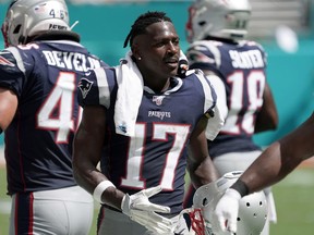 Then-New England Patriots wide receiver Antonio Brown (17) watches from the sidelines in 2019.