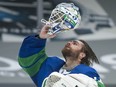 Vancouver Canucks' goalie Braden Holtby dons his mask during a game against the Ottawa Senators at Rogers Arena on April 24, 2021. Holtby is now playing for the Dallas Stars.