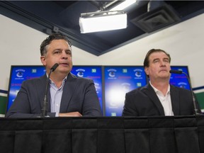 Vancouver Canucks head coach Travis Green and GM Jim Benning face the media at Rogers Arena.