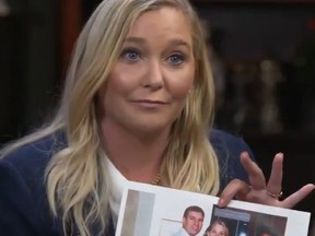 Virginia Roberts Giuffre holds a photo of her and Prince Andrew and Ghislaine Maxwell that she insists is not doctored.