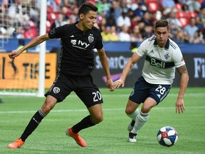 Whitecaps defender Jake Nerwinski (right), vying for the ball with Sporting KC’s Daniel Salloi during a 2019 MLS game at B.C. Place Stadium, says ‘we’re fine with that’ being underdogs in Saturday’s one-off playoff game against the same club.
