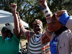 People react after the jury reached a guilty verdict in the trial of William "Roddie" Bryan, Travis McMichael and Gregory McMichael, charged with the February 2020 death of 25-year-old Ahmaud Arbery, in Brunswick, Georgia.