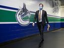 Canucks defender Oliver Ekman-Larsson fulfills the COVID-19 mask mandate as he enters Rogers Arena.