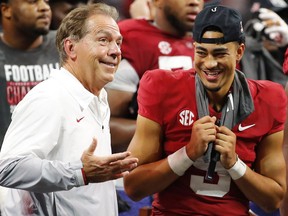 Alabama Crimson Tide head coach Nick Saban with star quarterback Bryce Young, celebrating their 41-24 win over the No. 1-ranked University of Georgia Bulldogs in the SEC Championship game at Mercedes-Benz Stadium in Atlanta, Ga., on Dec. 4, 2021.