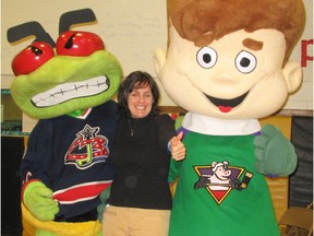 Children’s author Mary Shaw along with mascots, including one from the Columbus Blue Jackets, her husband Brad’s former team, during a school appearance in Columbus, Ohio.