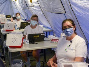 Nurses from Interior Health at a COVID-19 immunization clinic in Creston back in June.