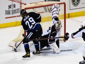 Vancouver Giants netminder Will Gurski gets his pad out to thwart Victoria Royals forward Bailey Peach on Saturday on Vancouver Island.