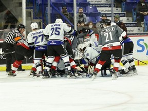 The Vancouver Giants and Victoria Royals converge in front of the Royals' net in Victoria's 3-1 win on Monday at the Langley Events Centre.