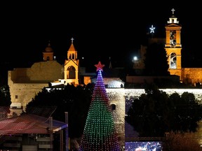 The lit Christmas tree at the Manger Square near the Church of the Nativity, revered as the site of Jesus Christ's birth, as the Palestinian city of Bethlehem prepares for Christmas.