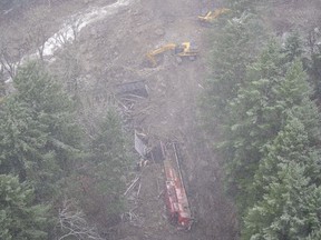 A Canadian Pacific locomotive and its cars knocked off of the train track by heavy rains and mudslides in the Fraser Canyon, near Hope, last month.