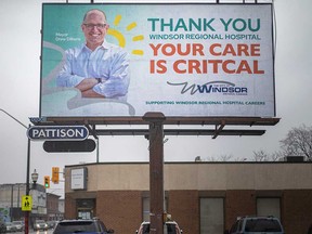 A Windsor billboard with a prominent typo and an image of Windsor Mayor Drew Dilkens, photographed Dec. 18, 2021.