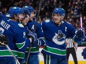 Canucks stars J.T. Miller, Brock Boeser, Oliver Ekman-Larsson and Bo Horvat (left to right), during their first game under new head coach Bruce Boudreau, will hope the positive vibes of December carry through the rest of this season.
