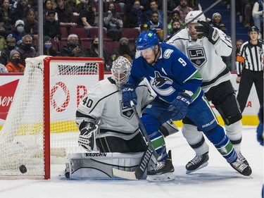 Dec 6, 2021; Vancouver, British Columbia, CAN; Los Angeles Kings goalie Cal Petersen (40) makes a save as defenseman Alexander Edler (2) battles with Vancouver Canucks forward J.T. Miller (9) in the first period at Rogers Arena. Mandatory Credit: Bob Frid-USA TODAY Sports