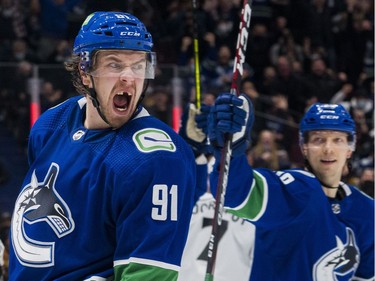 Dec 6, 2021; Vancouver, British Columbia, CAN; Vancouver Canucks forward Alex Chiasson (39) and forward Juho Lammikko (91) celebrate Lammikko's first goal as a Canucks against the Los Angeles Kings in the third period at Rogers Arena. Vancouver won 4-0. Mandatory Credit: Bob Frid-USA TODAY Sports