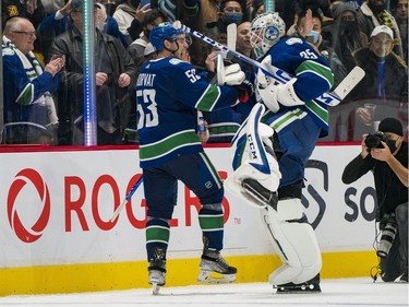 Dec 6, 2021; Vancouver, British Columbia, CAN; Vancouver Canucks forward Bo Horvat (53) and goalie Thatcher Demko (35) celebrate their victory over the Los Angeles Kings in the third period at Rogers Arena. Vancouver won 4-0. Mandatory Credit: Bob Frid-USA TODAY Sports