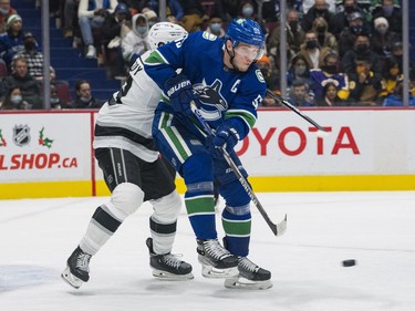 Dec 6, 2021; Vancouver, British Columbia, CAN; Vancouver Canucks forward Bo Horvat (53) redirects the puck against the Los Angeles Kings in the first period at Rogers Arena. Mandatory Credit: Bob Frid-USA TODAY Sports