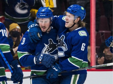 Dec 6, 2021; Vancouver, British Columbia, CAN; Vancouver Canucks forward J.T. Miller (9) and forward Brock Boeser (6) celebrate Miller's goal against the Los Angeles Kings in the third period at Rogers Arena. Vancouver won 4-0. Mandatory Credit: Bob Frid-USA TODAY Sports