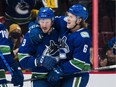 The sheer will and drive of Canucks forward J.T. Miller (left), celebrating one of his 15 goals this season with teammate Brock Boeser, can’t be questioned.