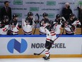 Canada's Landon Ferraro skates by the bench, getting congratulated by his teammates after scoring against Finland at the Channel One Cup tournament in Moscow last weekend.