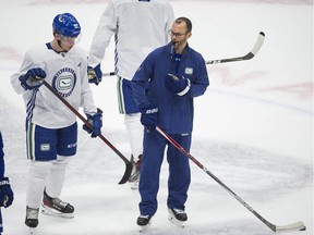Canucks' assistant coach Jason King (with glasses) at team practice at Rogers Arena in Vancouver, BC Wednesday, October 6, 2021.