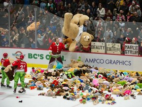 Then-Giants goalie Trent Miner reaches for a giant teddy bear coming over the glass in the last annual Teddy Bear Toss game that the Giants hosted, a December 2019 game at Rogers Arena. This year's game goes Friday at the Langley Events Centre.