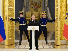 Russian President Vladimir Putin during a ceremony at the Kremlin's Alexander Hall in Moscow, on December 1, 2021. (Photo by Grigory SYSOYEV / SPUTNIK / AFP)