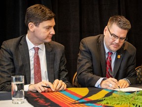 B.C. Attorney-General David Eby and Doug White, chair of the BC First Nations Justice Council, sign strategic agreement.