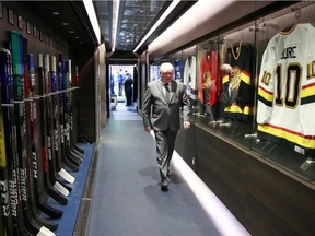 Head coach Bruce Boudreau of the Vancouver Canucks walks past the dressing room before their NHL game against the Winnipeg Jets at Rogers Arena December 10, 2021 in Vancouver, British Columbia, Canada.