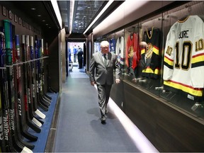 Head coach Bruce Boudreau of the Vancouver Canucks walks past the dressing room.