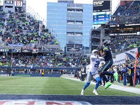 DK Metcalf #14 of the Seattle Seahawks catches a pass for a touchdown during the third quarter against the Detroit Lions at Lumen Field on January 02, 2022 in Seattle, Washington.