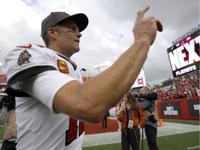 TAMPA, FLORIDA - JANUARY 16: Tom Brady #12 of the Tampa Bay Buccaneers celebrates after defeating the Philadelphia Eagles in the NFC Wild Card Playoff game at Raymond James Stadium on January 16, 2022 in Tampa, Florida.