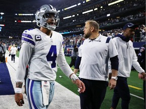 Dak Prescott #4 of the Dallas Cowboys walks off the field after losing to the San Francisco 49ers 23-17 in the NFC Wild Card Playoff game at AT&T Stadium on January 16, 2022 in Arlington, Texas.