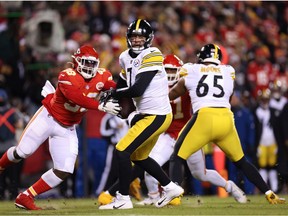 Ben Roethlisberger #7 of the Pittsburgh Steelers looks to throw the ball as Tershawn Wharton #98 of the Kansas City Chiefs defends in the first quarter in the NFC Wild Card Playoff game at Arrowhead Stadium on January 16, 2022 in Kansas City, Missouri.