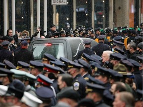 The hearse carrying the casket of fallen NYPD Officer Jason Rivera leaves St. Patrick's Cathedral during his funeral January 28, 2022 in New York City.