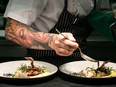 A chef plates food in this undated handout photo from the Dine Out Vancouver Festival.