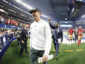 Head coach Kyle Shanahan of the San Francisco 49ers walks off the field after defeating the Dallas Cowboys.