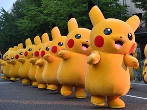 This file picture taken on August 2, 2015 shows costumed performers dressed as Pikachu, the popular animation Pokemon series character, attending a promotional event at the Yokohama Dance Parade in Yokohama.