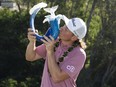 Cameron Smith kisses the trophy after winning the Sentry Tournament of Champions at Kapalua Resort - The Plantation Course.