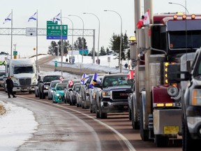 Truck drivers protesting against coronavirus disease (COVID-19) vaccine mandates drive in a convoy on the Nova Scotia/New Brunswick provincial boundary in Fort Lawrence, Nova Scotia, Canada, January 23, 2022