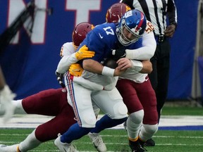 Washington Football Team defensive ends James Smith-Williams (96) and Shaka Toney (58) sack New York Giants QB Jake Fromm during NFL action at MetLife Stadium in East Rutherford, N.J., Sunday, Jan. 9, 2022.
