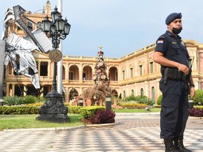 View of the main tower of the Palacio de Lopez (Government Palace) after a storm with hurricane force winds in Asuncion, on December 30, 2021.