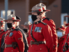 Members of the RCMP stand at attention during a Remembrance Day ceremony in Iqaluit, Nunavut, on November 11, 2021.