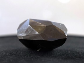 A 555.55 carat black diamond named The Enigma is pictured before being auctioned at Sotheby's in Beverly Hills, California, U.S., January 26, 2022.