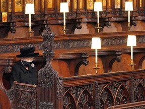 Queen Elizabeth II takes her seat for the funeral of Britain's Prince Philip.