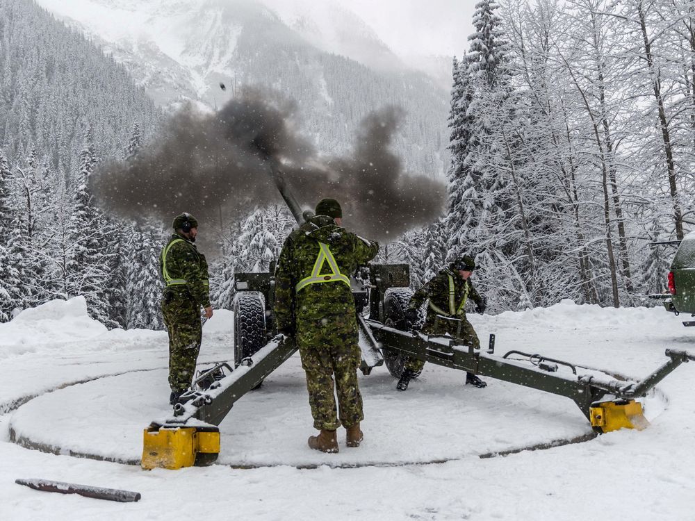 Gunners from the 1st Regiment, Royal Canadian Horse Artillery, fire a 105mm C3 Howitzer gun as part of Operation Palaci to clear snow pack in danger of avalanche at Rogers Pass in B.C.