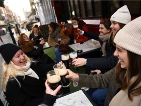 People enjoy outdoor dining, amid the spread of the coronavirus disease (COVID-19) pandemic, in Dublin, Ireland, December 17, 2021.