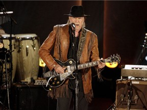 Singer/songwriter Neil Young performs during a concert honoring singer/songwriter Willie Nelson, recipient of the Library of Congress' Gershwin Prize for Popular Song, in Washington November 18, 2015.
