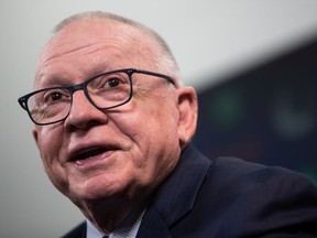 New Vancouver Canucks President of Hockey Operations and Interim General Manager Jim Rutherford jokes with a reporter during his first news conference since being hired by the NHL hockey team, in Vancouver, on Monday, December 13, 2021.